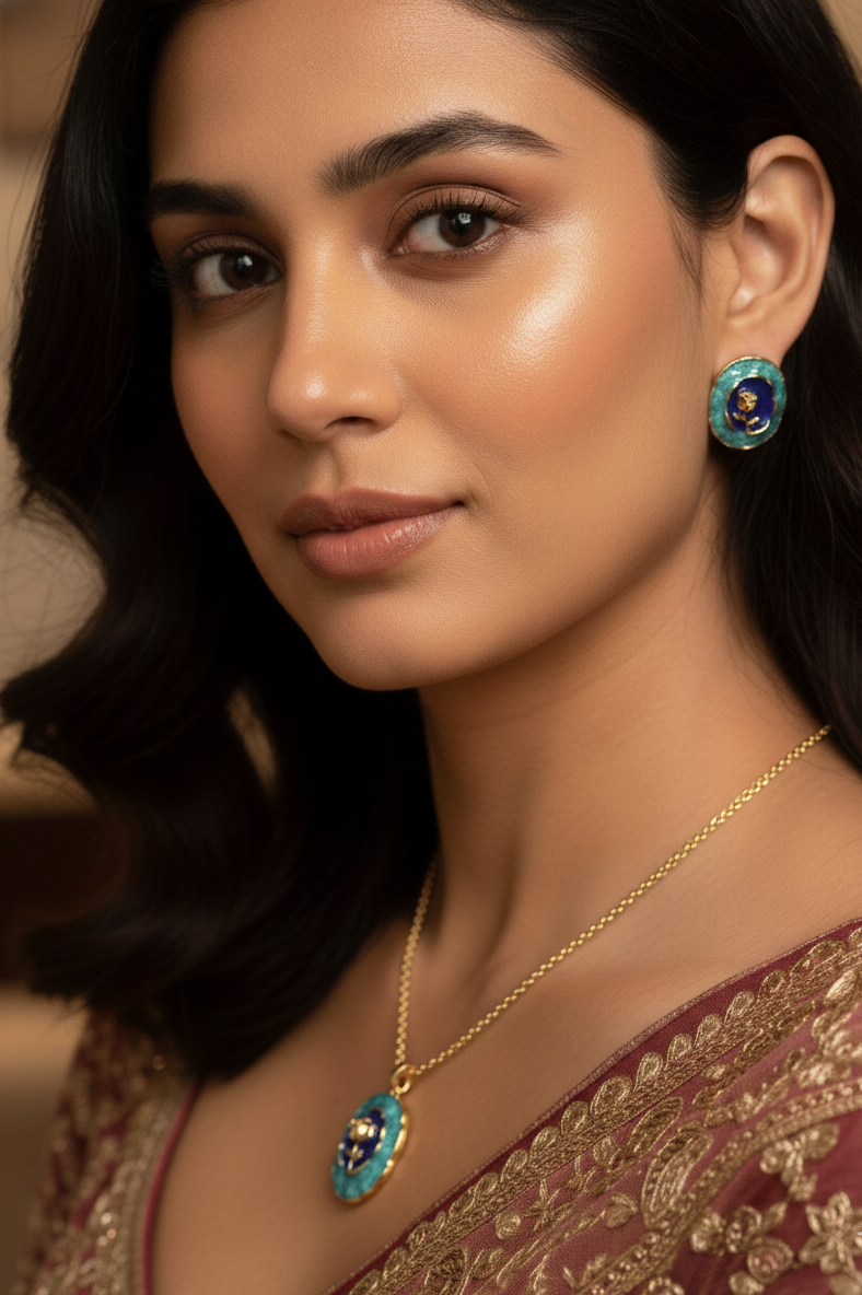 Woman wearing a gold necklace and earrings with a blurred background